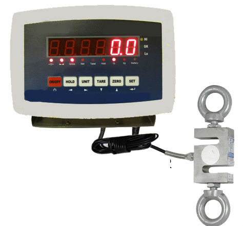 Untitled Digital weighing scale display with control buttons and connected load cell sensor, ideal for use in industrial weighing applications or calibration labs.
